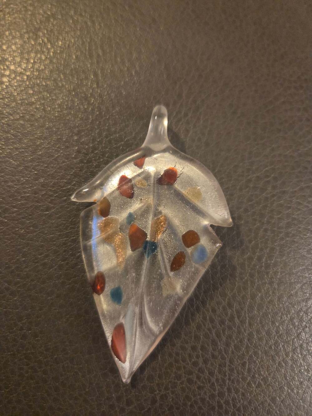 Vintage handmade leaf-shaped glass art pendant with colorful foil and speckles